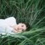 Woman lying down on grass